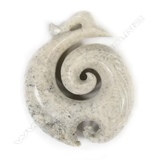 A carved whale jawbone pendant,